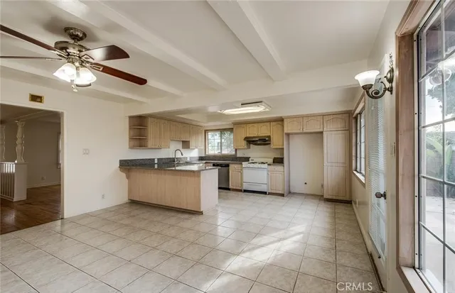 a large kitchen with a cabinets and a counter top space