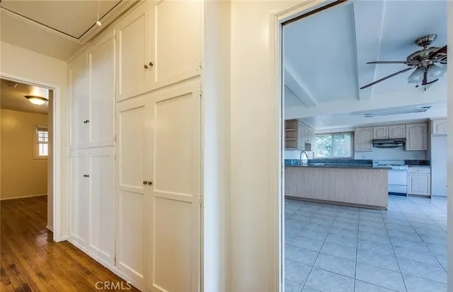 a view of large kitchen with cabinets