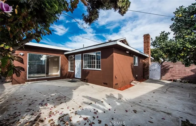 a view of a house with a snow in the backyard