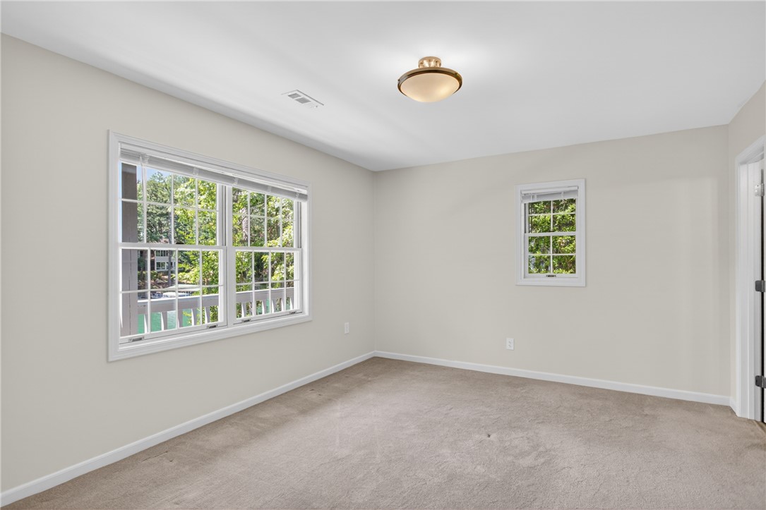 9 Lookout Lane Salem, SC 29676 - Photo 25 of 46 Natural light floods this inviting room through multiple windows overlooking leafy treetops.