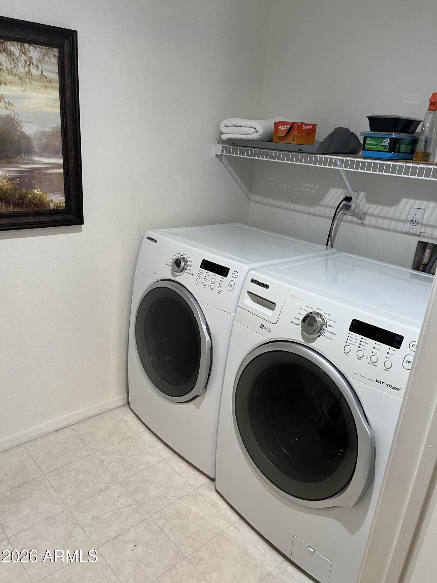 10030 West Indian School Road, Unit 133 Phoenix, AZ 85037 - Photo 10 of 17 a utility room with dryer and washer