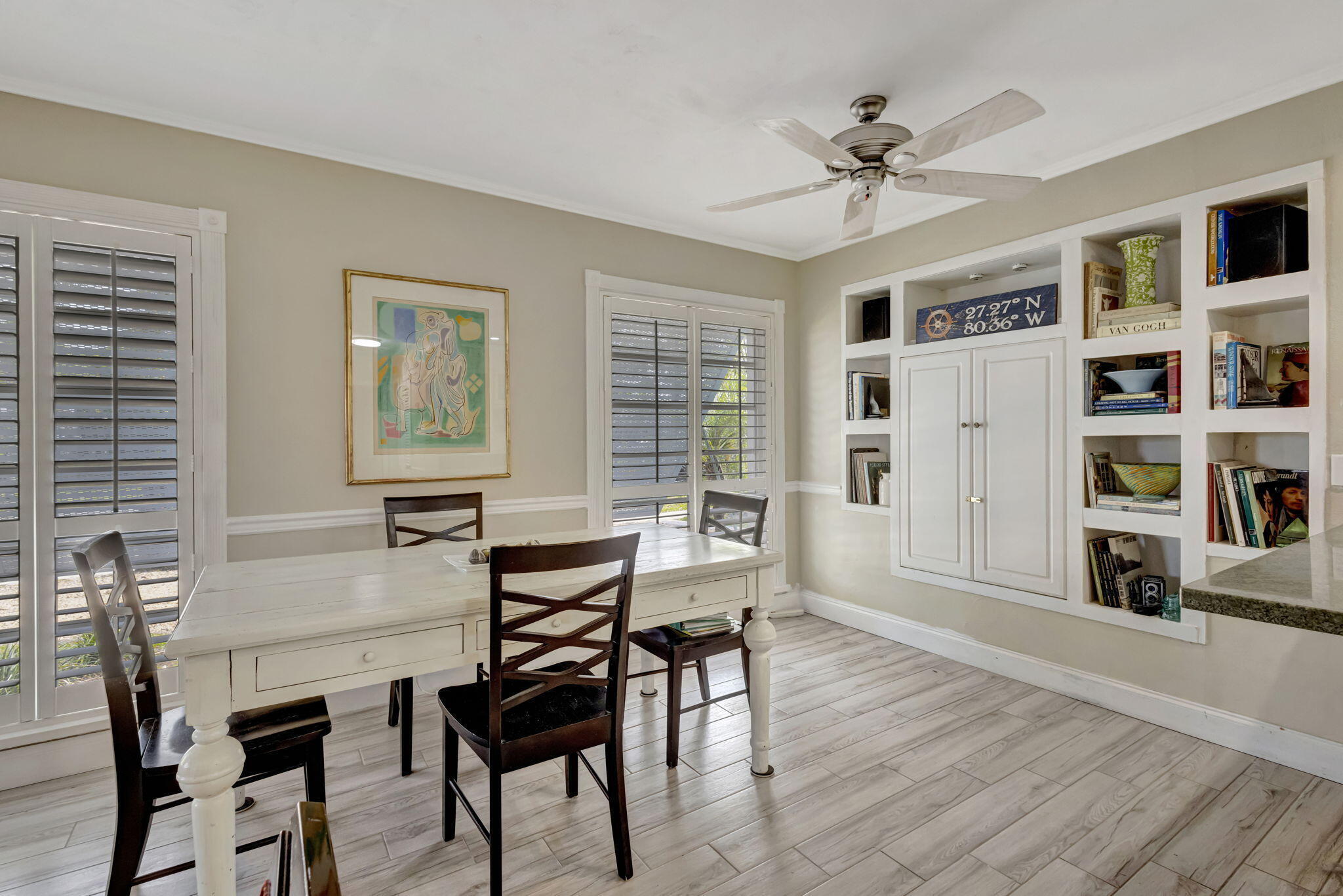 2940 Southeast Treasure Island Road Port St. Lucie, FL 34952 - Photo 13 of 61 a view of a livingroom with furniture and a bookshelf