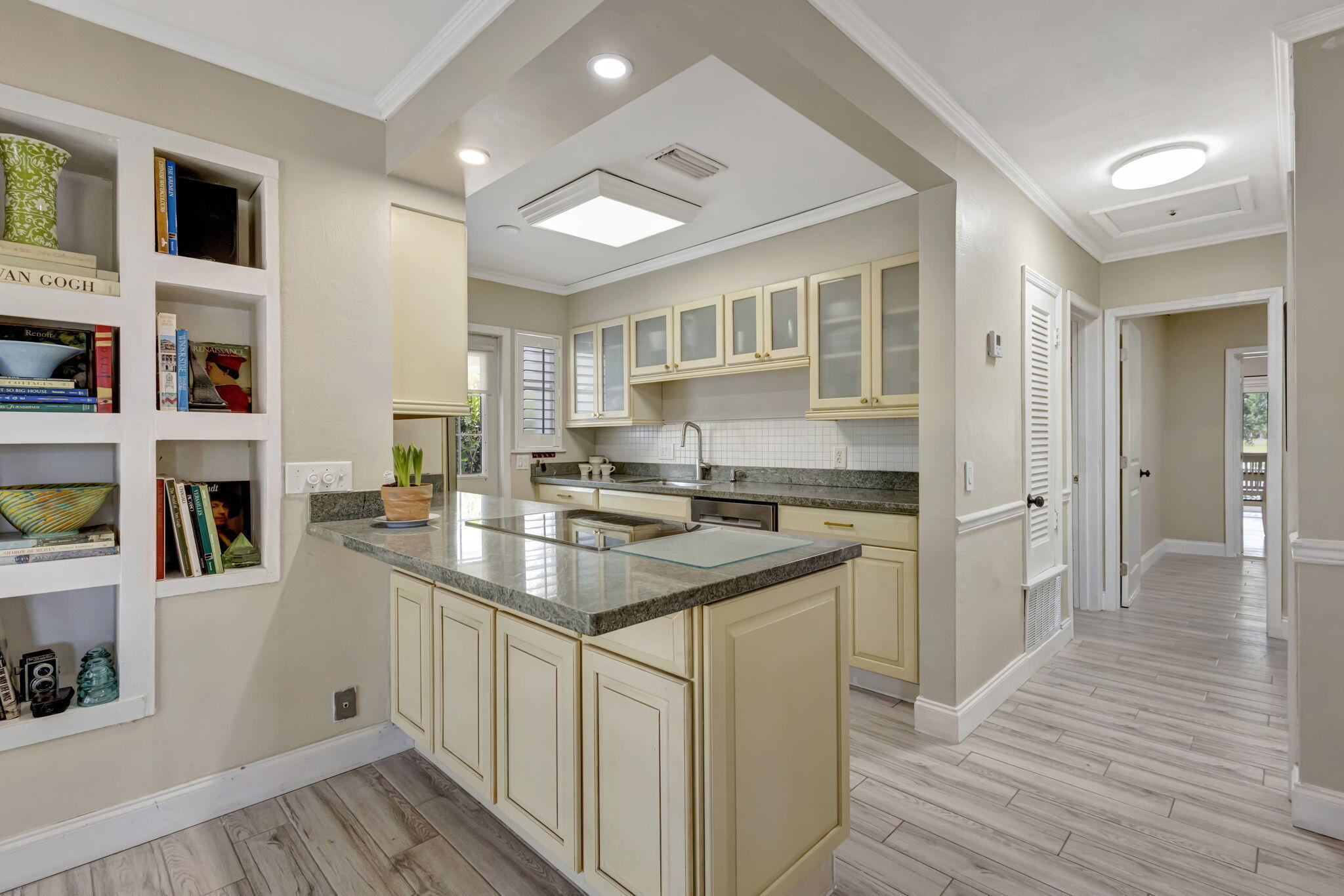 2940 Southeast Treasure Island Road Port St. Lucie, FL 34952 - Photo 14 of 61 a kitchen with stainless steel appliances granite countertop a sink stove and cabinets