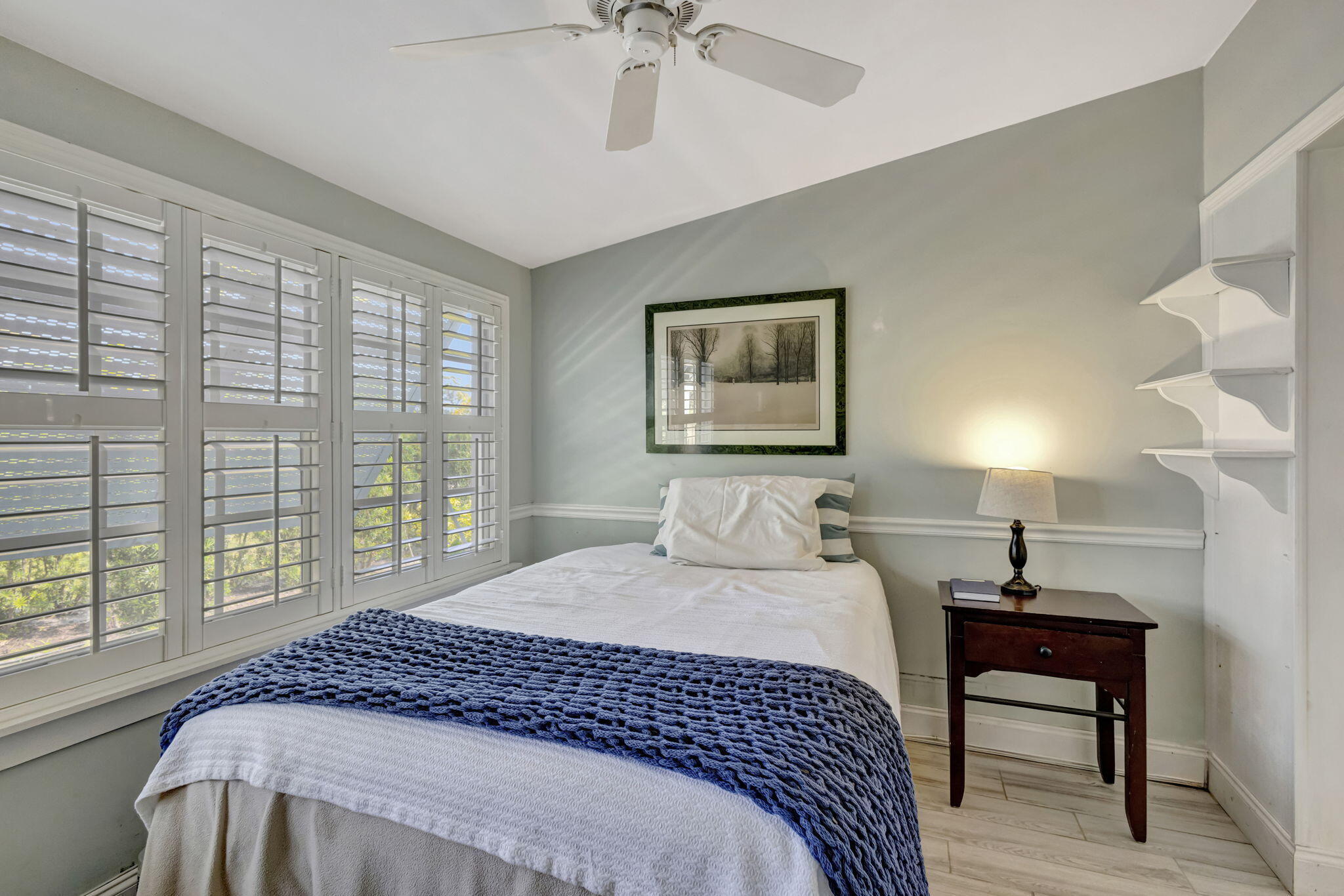 2940 Southeast Treasure Island Road Port St. Lucie, FL 34952 - Photo 20 of 61 a bedroom with a bed and a window