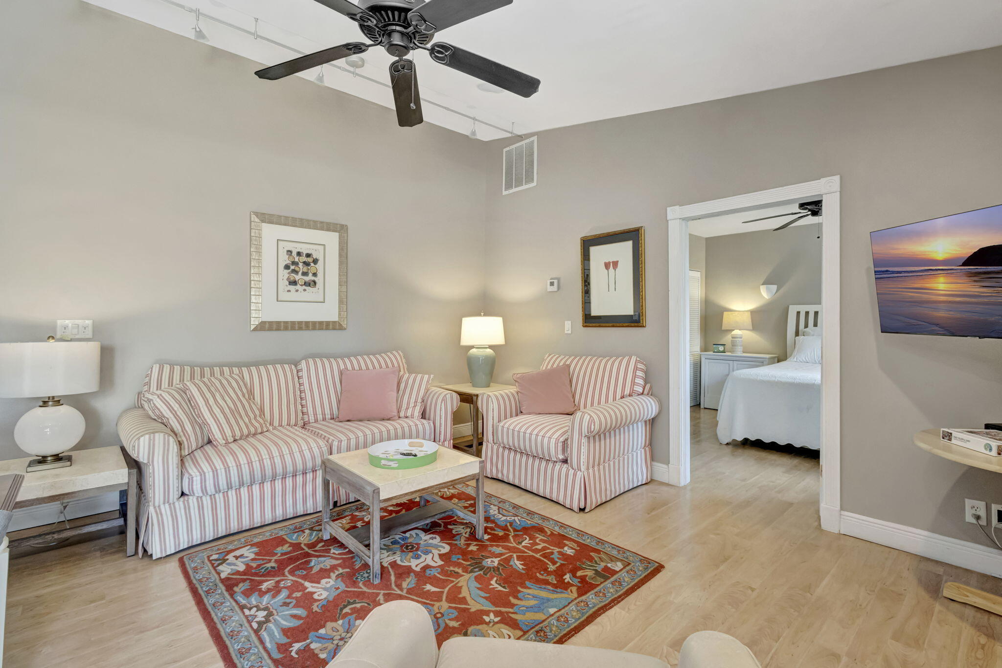 2940 Southeast Treasure Island Road Port St. Lucie, FL 34952 - Photo 29 of 61 a living room with furniture and a lamp