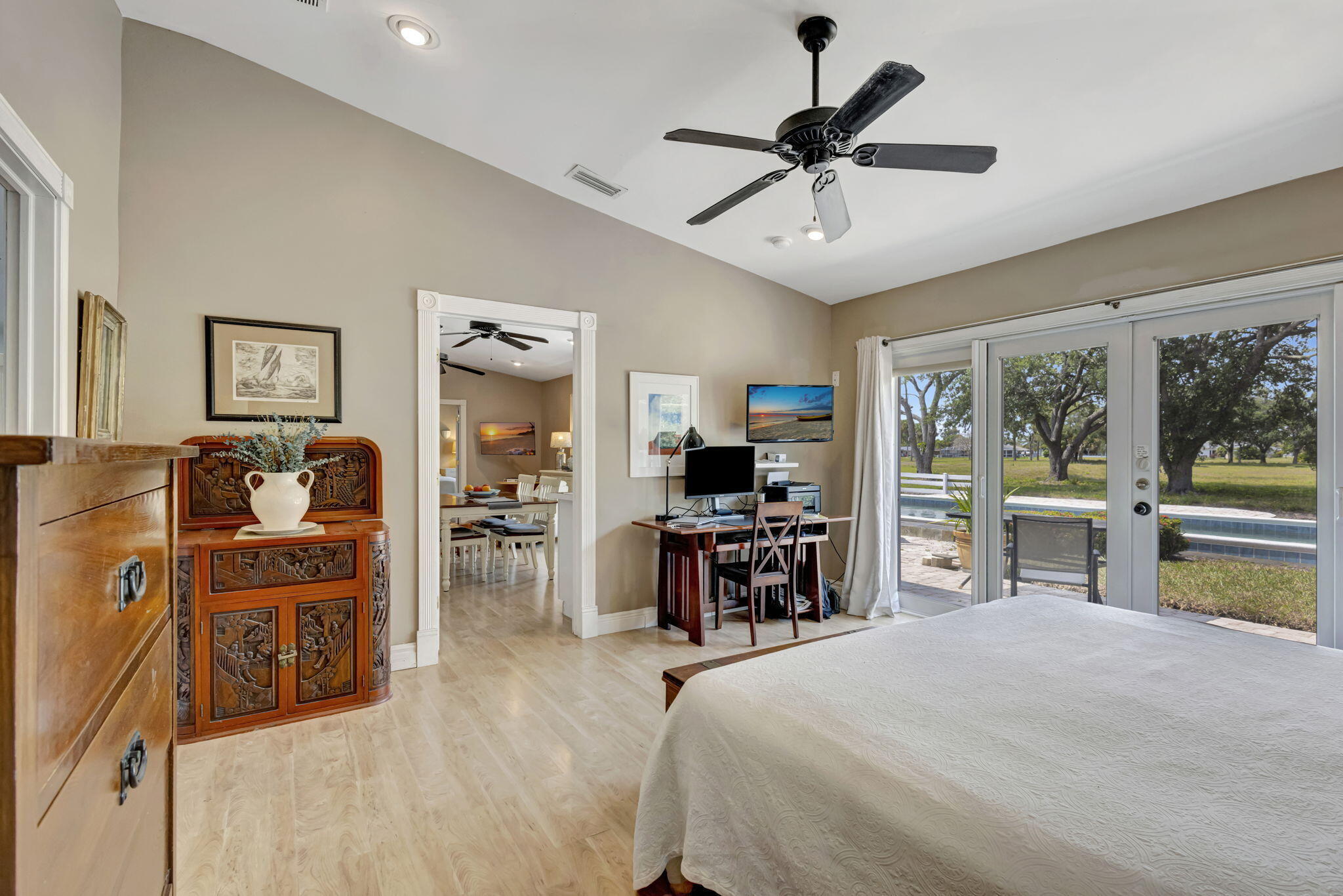 2940 Southeast Treasure Island Road Port St. Lucie, FL 34952 - Photo 31 of 61 a bedroom with furniture and a large window