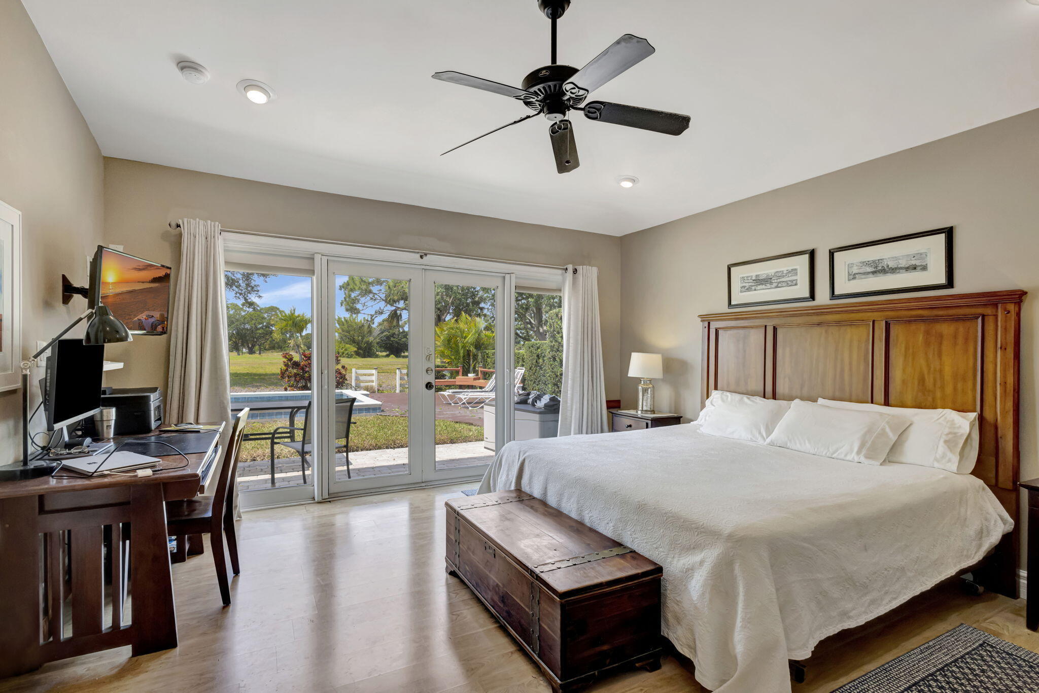 2940 Southeast Treasure Island Road Port St. Lucie, FL 34952 - Photo 33 of 61 a bedroom with a bed and a large window