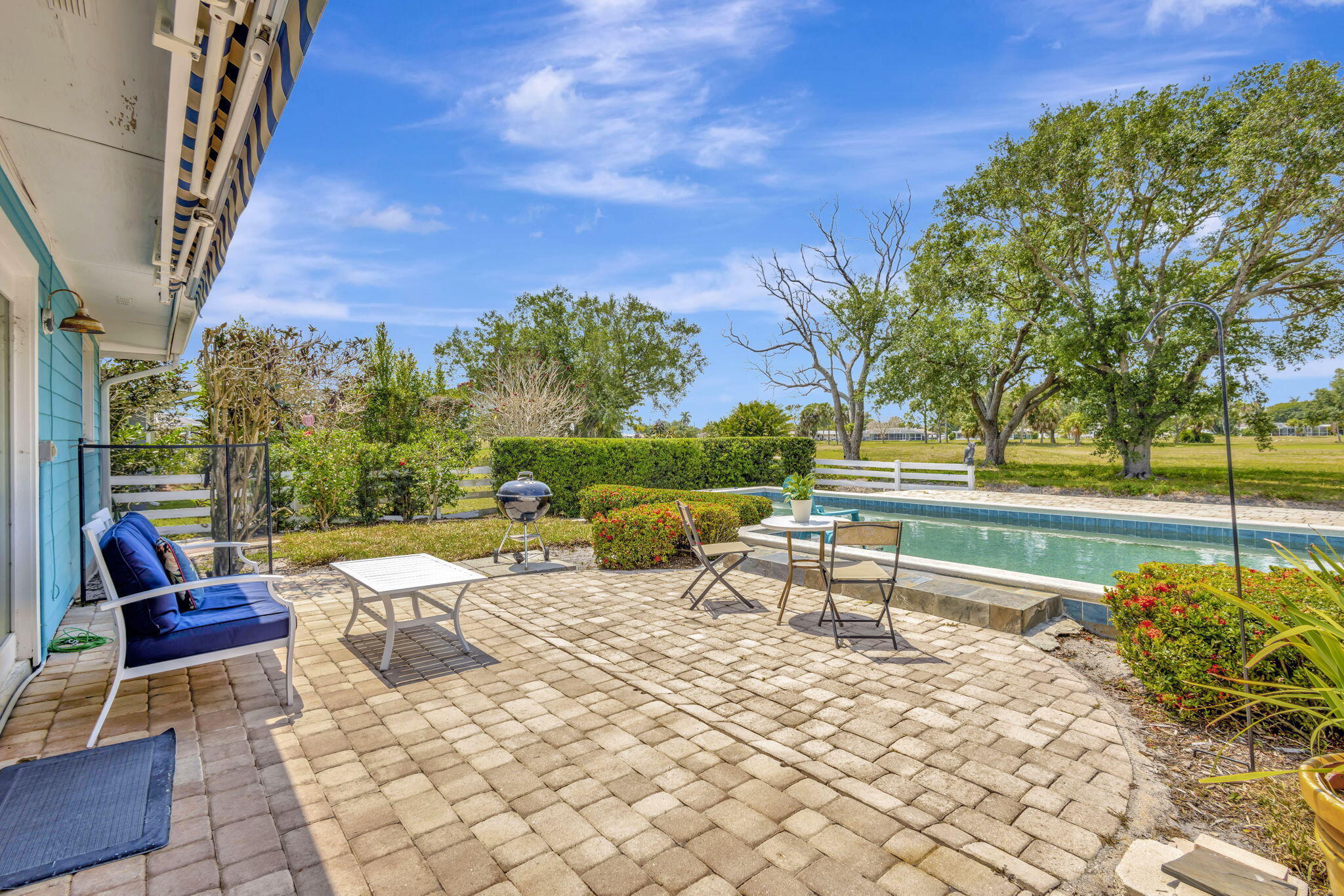 2940 Southeast Treasure Island Road Port St. Lucie, FL 34952 - Photo 40 of 61 a view of a swimming pool with a patio