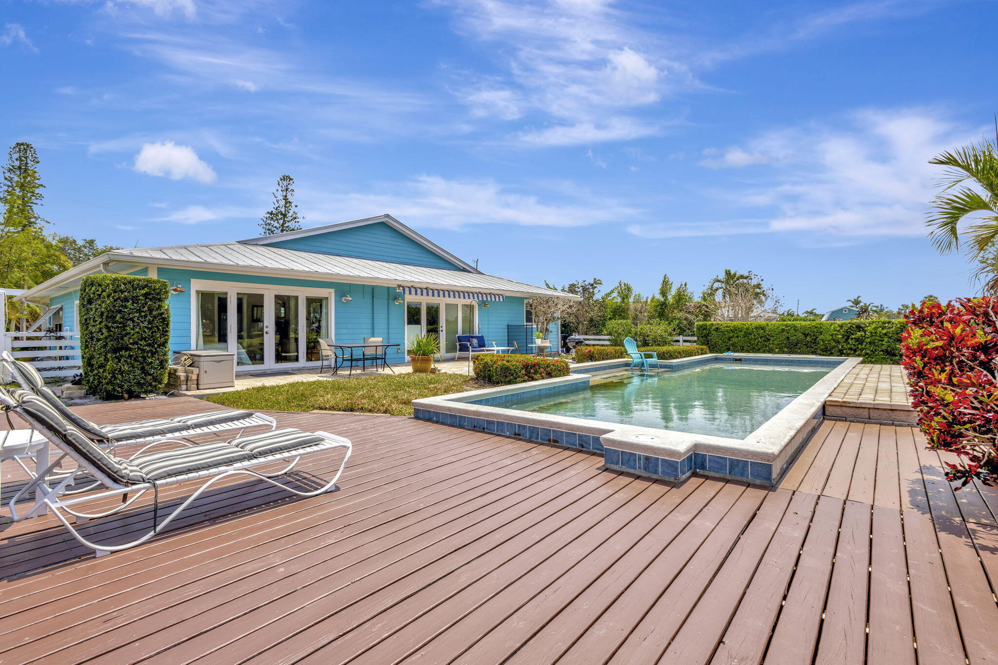 2940 Southeast Treasure Island Road Port St. Lucie, FL 34952 - Photo 41 of 61 a view of house with swimming pool and sitting area