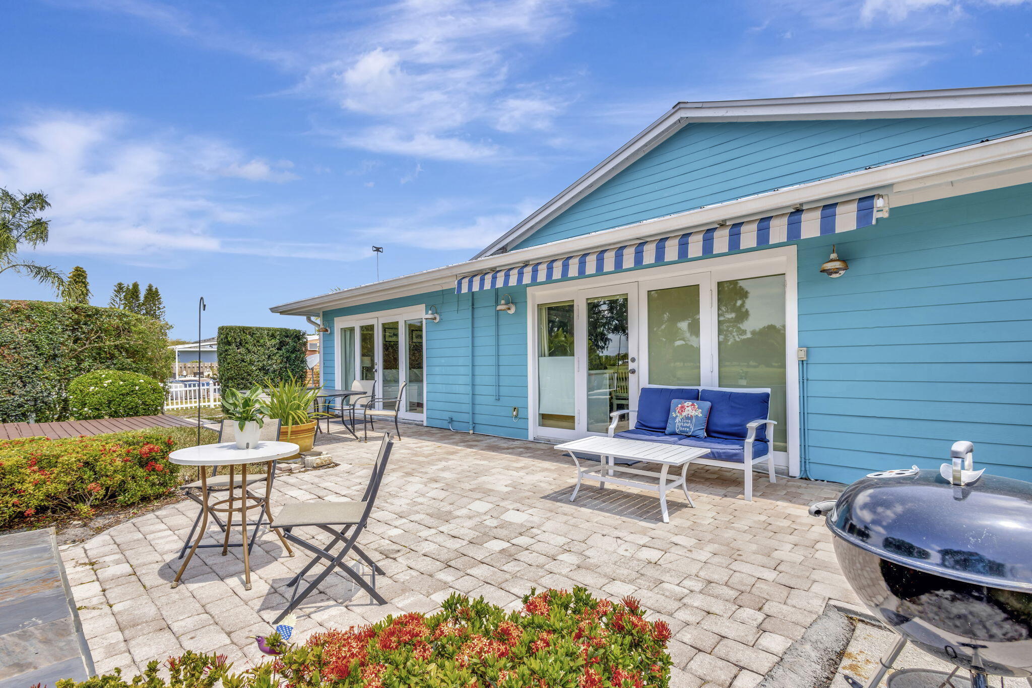 2940 Southeast Treasure Island Road Port St. Lucie, FL 34952 - Photo 43 of 61 a building outdoor space with patio furniture and potted plants