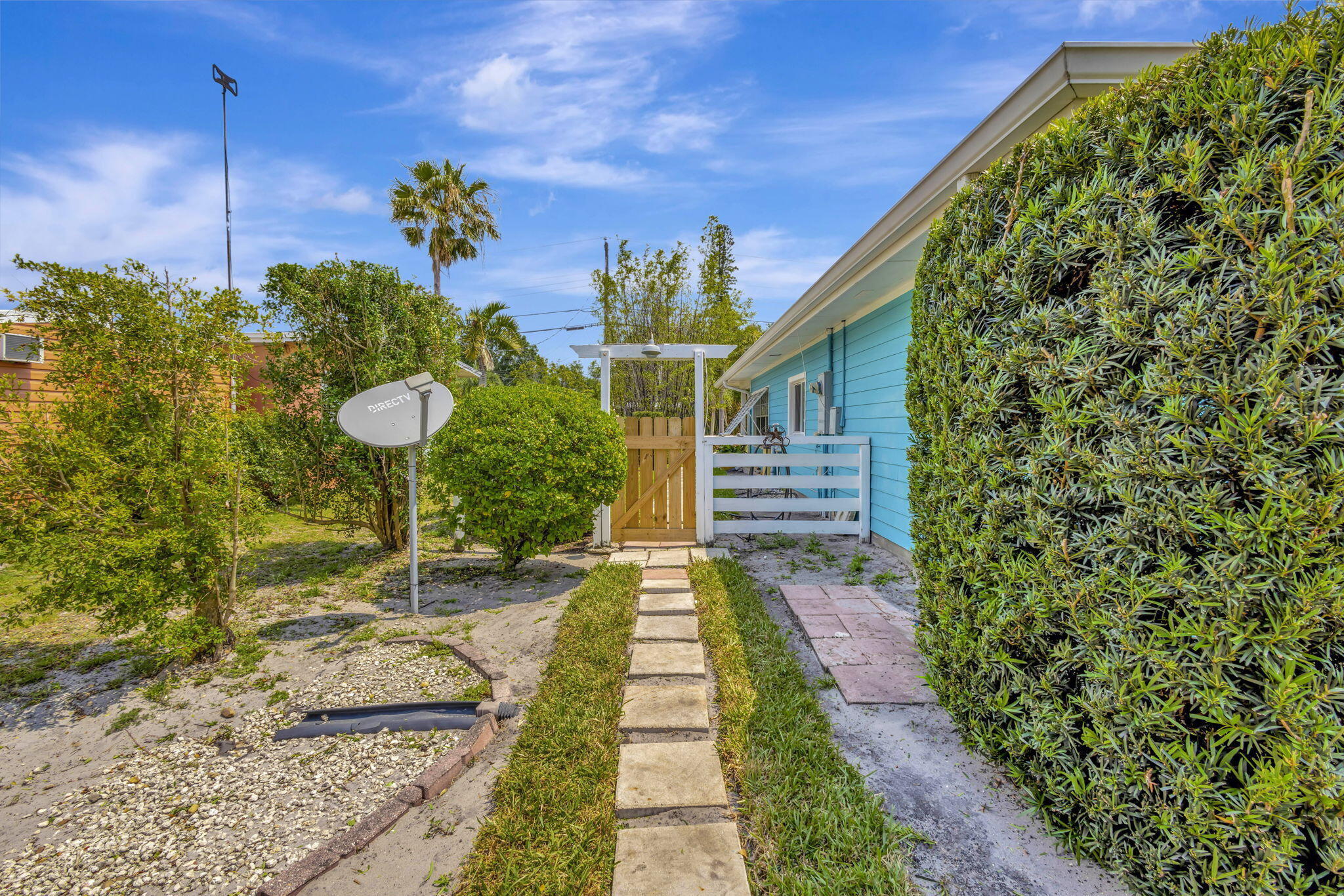 2940 Southeast Treasure Island Road Port St. Lucie, FL 34952 - Photo 44 of 61 a view of a pathway with a yard