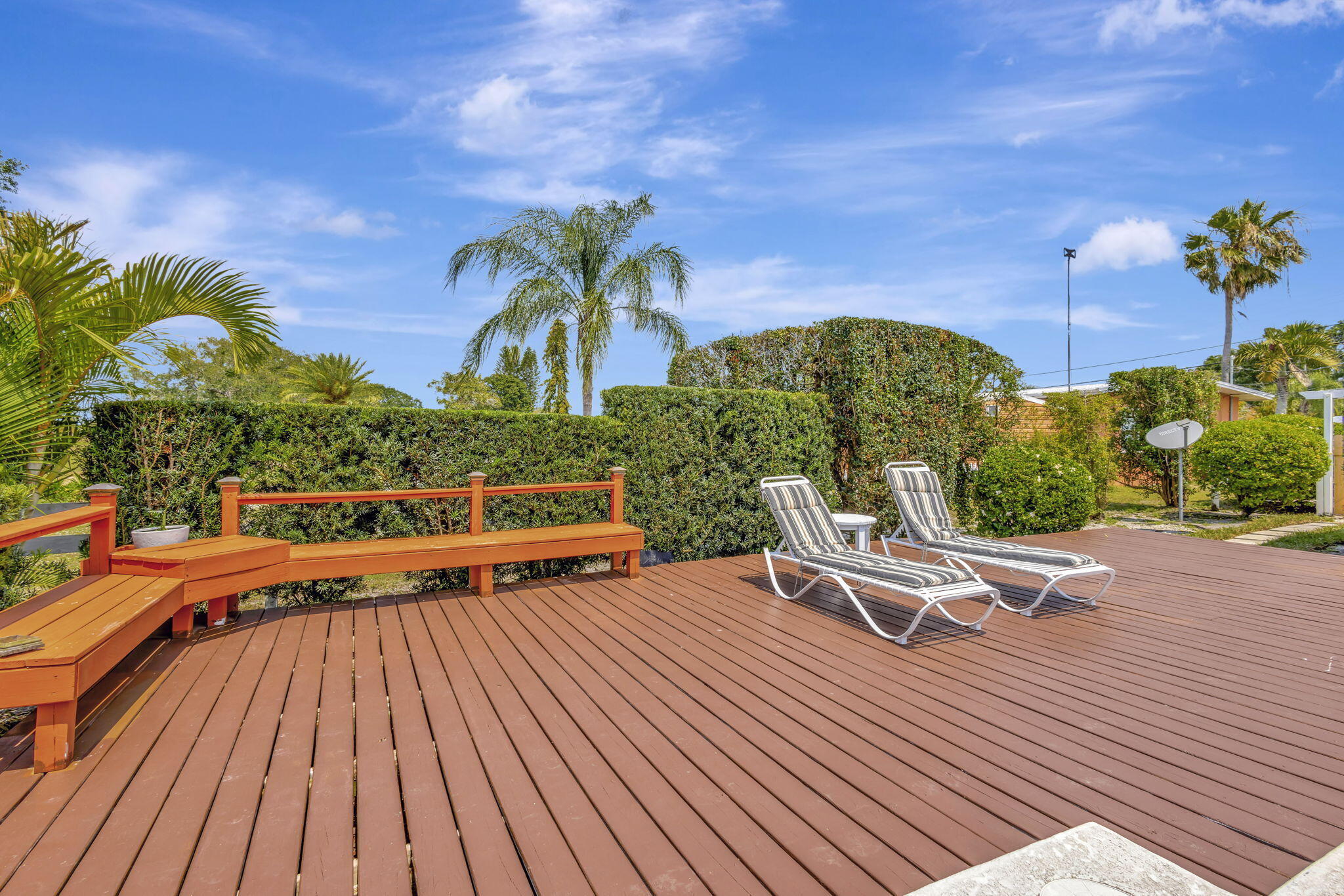 2940 Southeast Treasure Island Road Port St. Lucie, FL 34952 - Photo 45 of 61 a roof deck with a table and chairs
