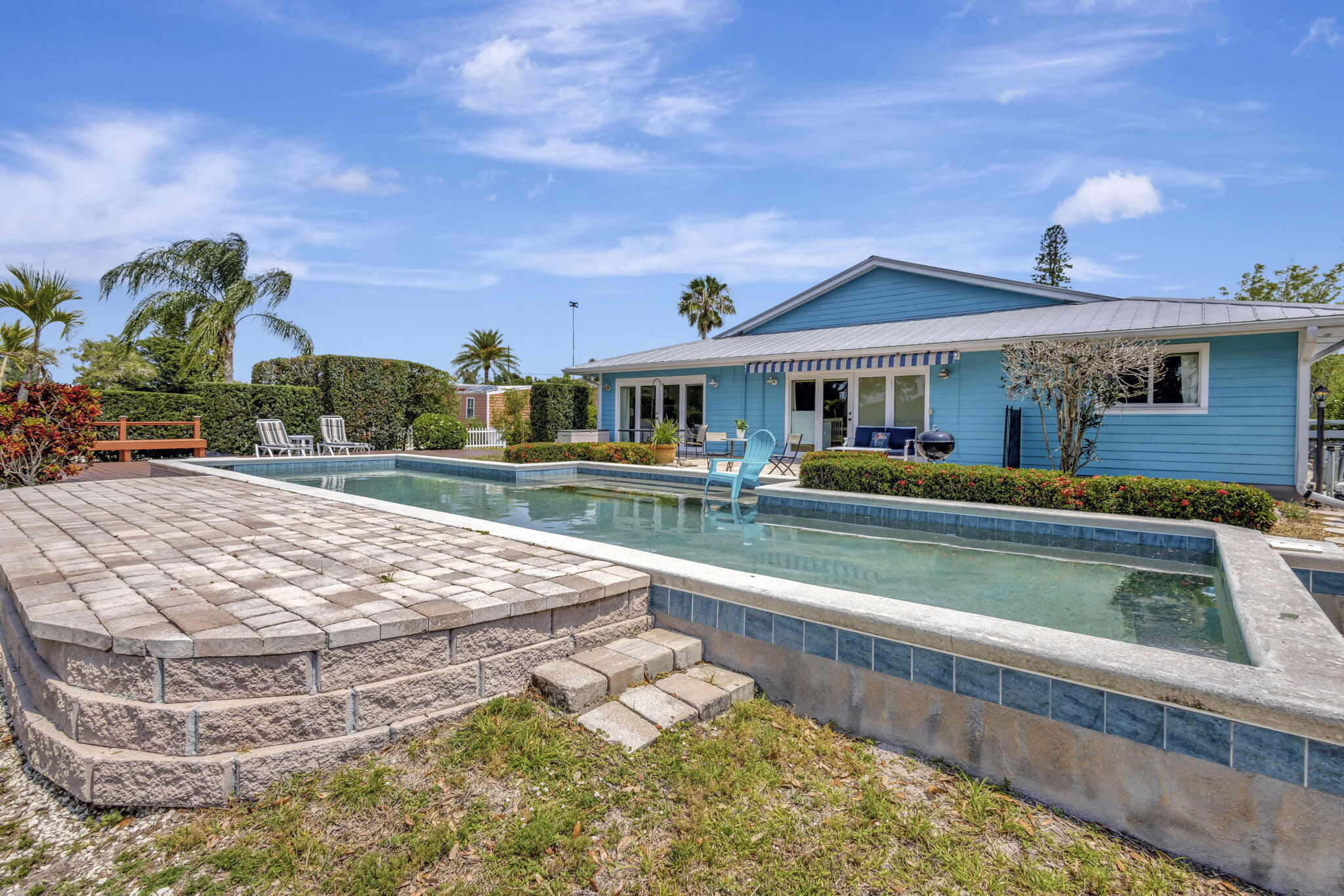 2940 Southeast Treasure Island Road Port St. Lucie, FL 34952 - Photo 48 of 61 a view of a house with a swimming pool
