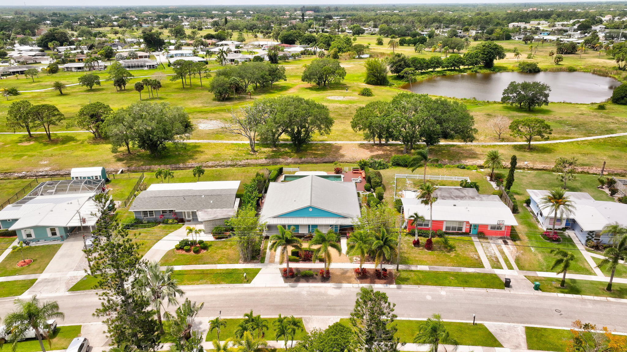 2940 Southeast Treasure Island Road Port St. Lucie, FL 34952 - Photo 50 of 61 an aerial view of residential houses with outdoor space