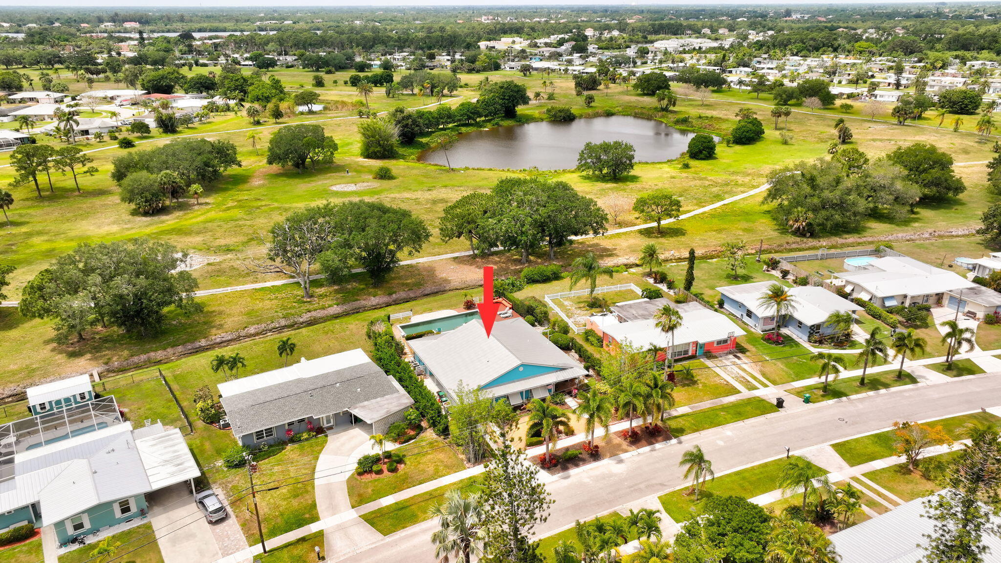 2940 Southeast Treasure Island Road Port St. Lucie, FL 34952 - Photo 51 of 61 an aerial view of residential houses with outdoor space