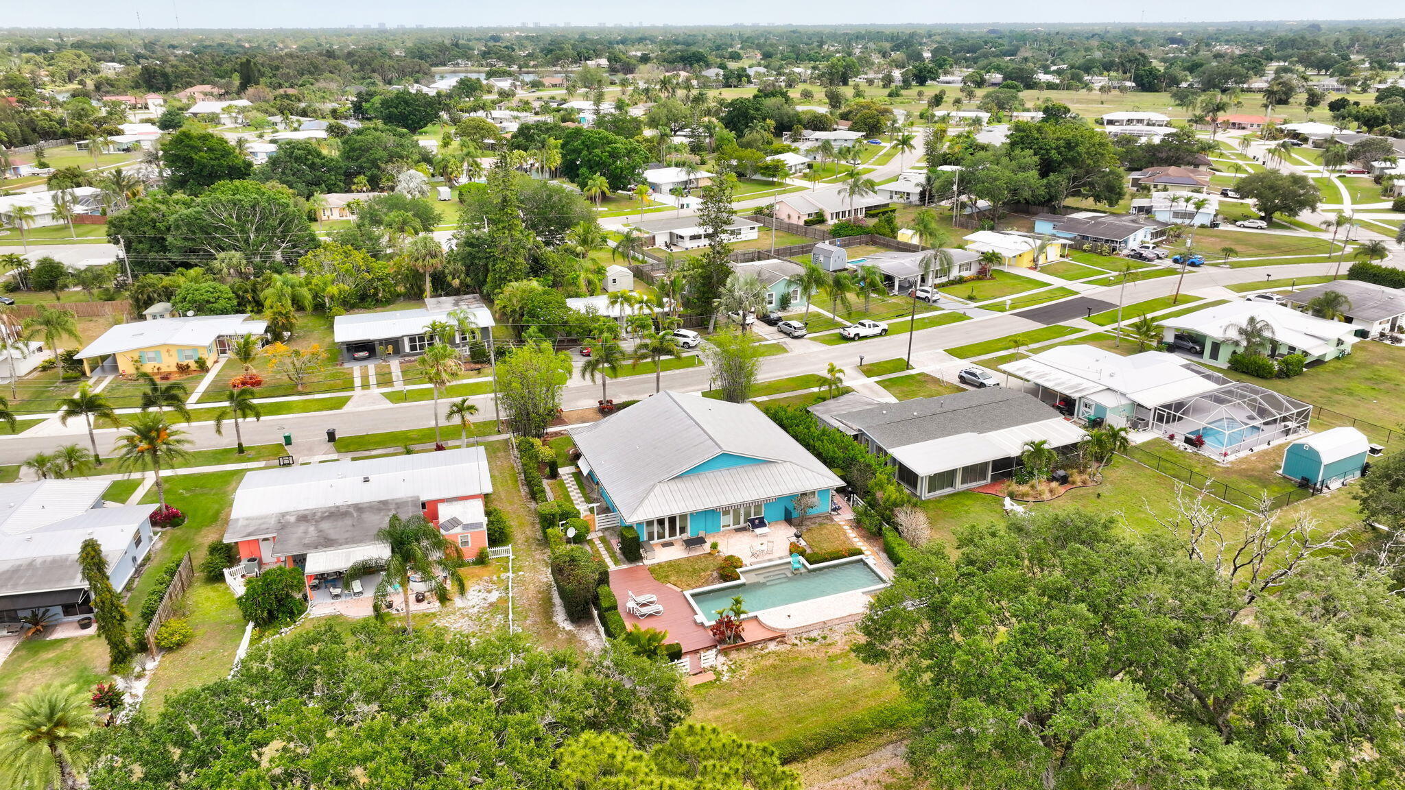 2940 Southeast Treasure Island Road Port St. Lucie, FL 34952 - Photo 56 of 61 an aerial view of residential houses with outdoor space