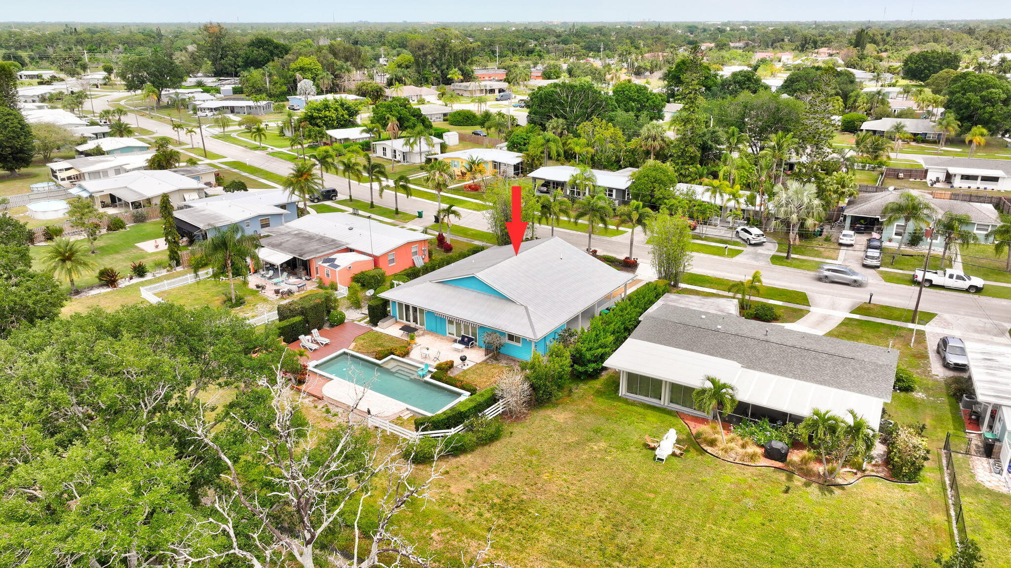 2940 Southeast Treasure Island Road Port St. Lucie, FL 34952 - Photo 57 of 61 an aerial view of residential houses with outdoor space and parking
