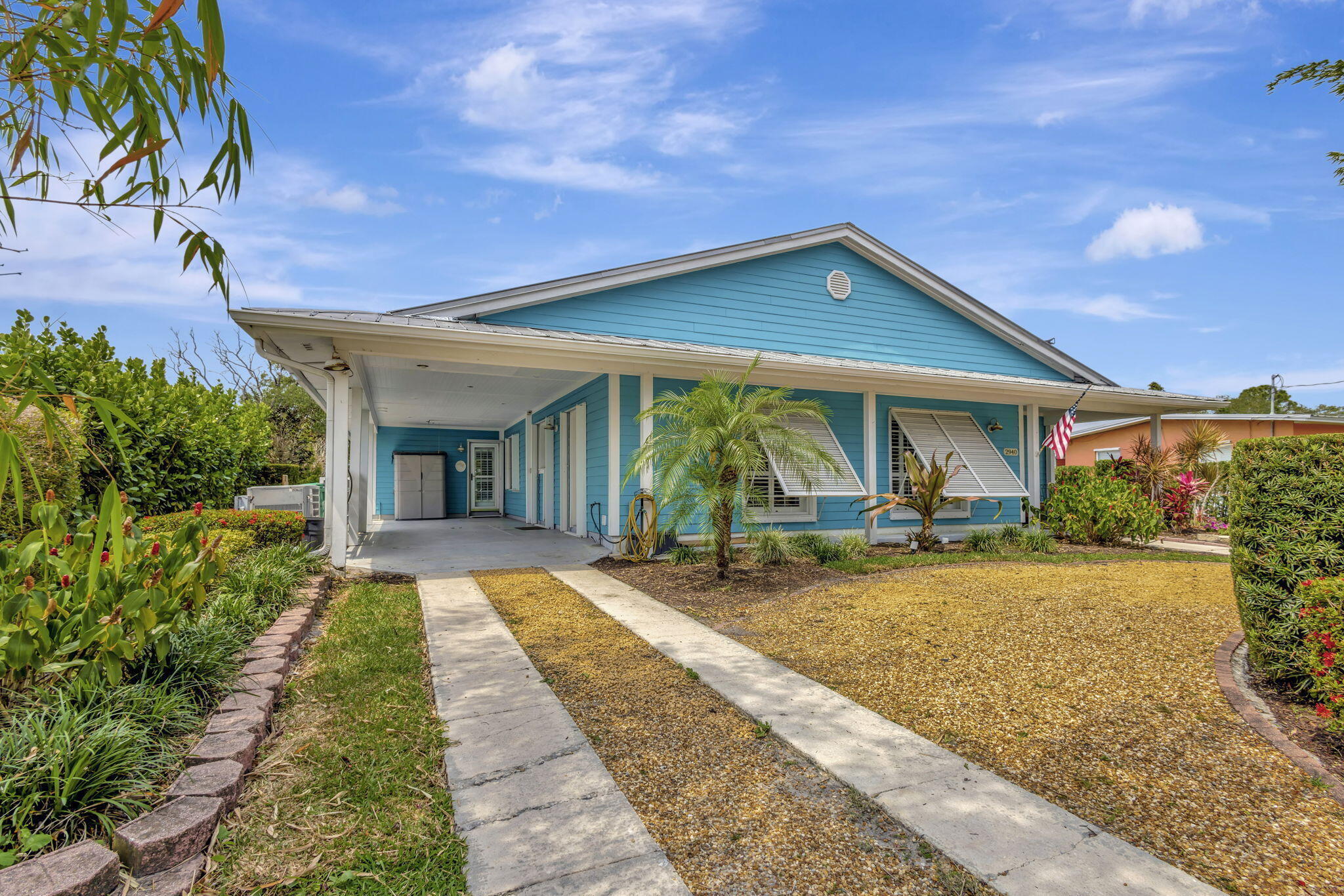 2940 Southeast Treasure Island Road Port St. Lucie, FL 34952 - Photo 58 of 61 a view of a house with sitting area and garden
