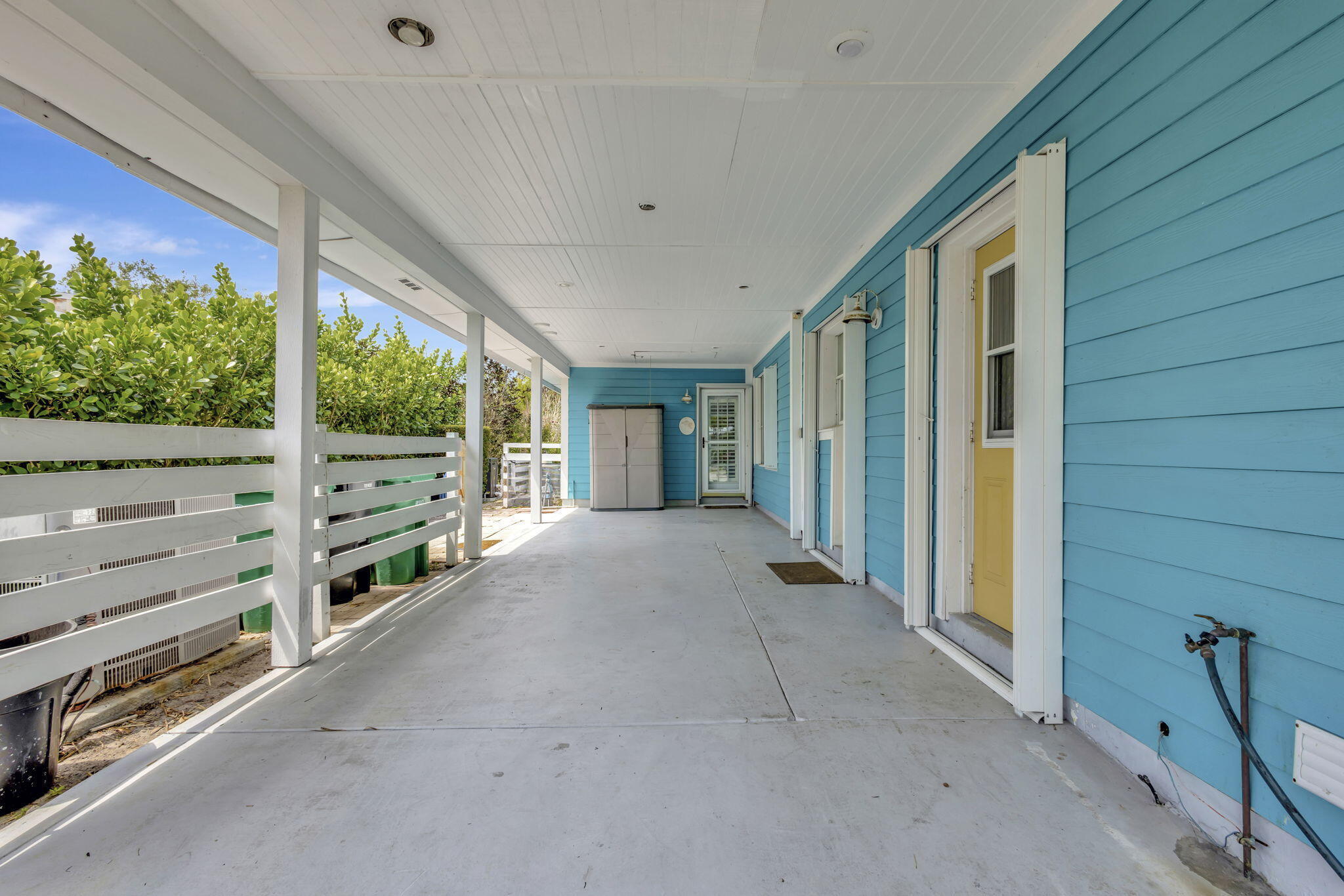 2940 Southeast Treasure Island Road Port St. Lucie, FL 34952 - Photo 59 of 61 a view of an entryway with wooden fence