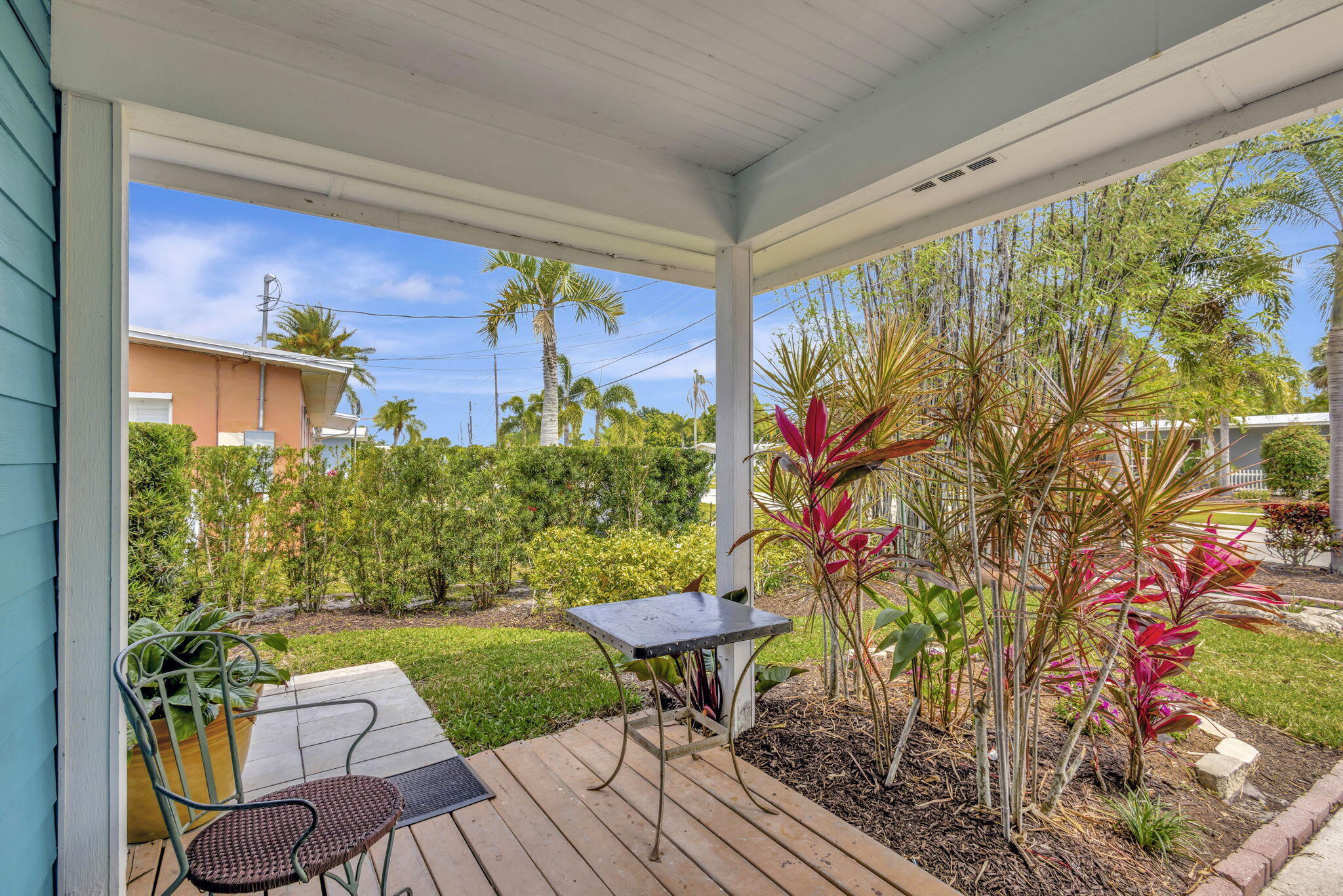 2940 Southeast Treasure Island Road Port St. Lucie, FL 34952 - Photo 6 of 61 a view of a porch with furniture and a yard