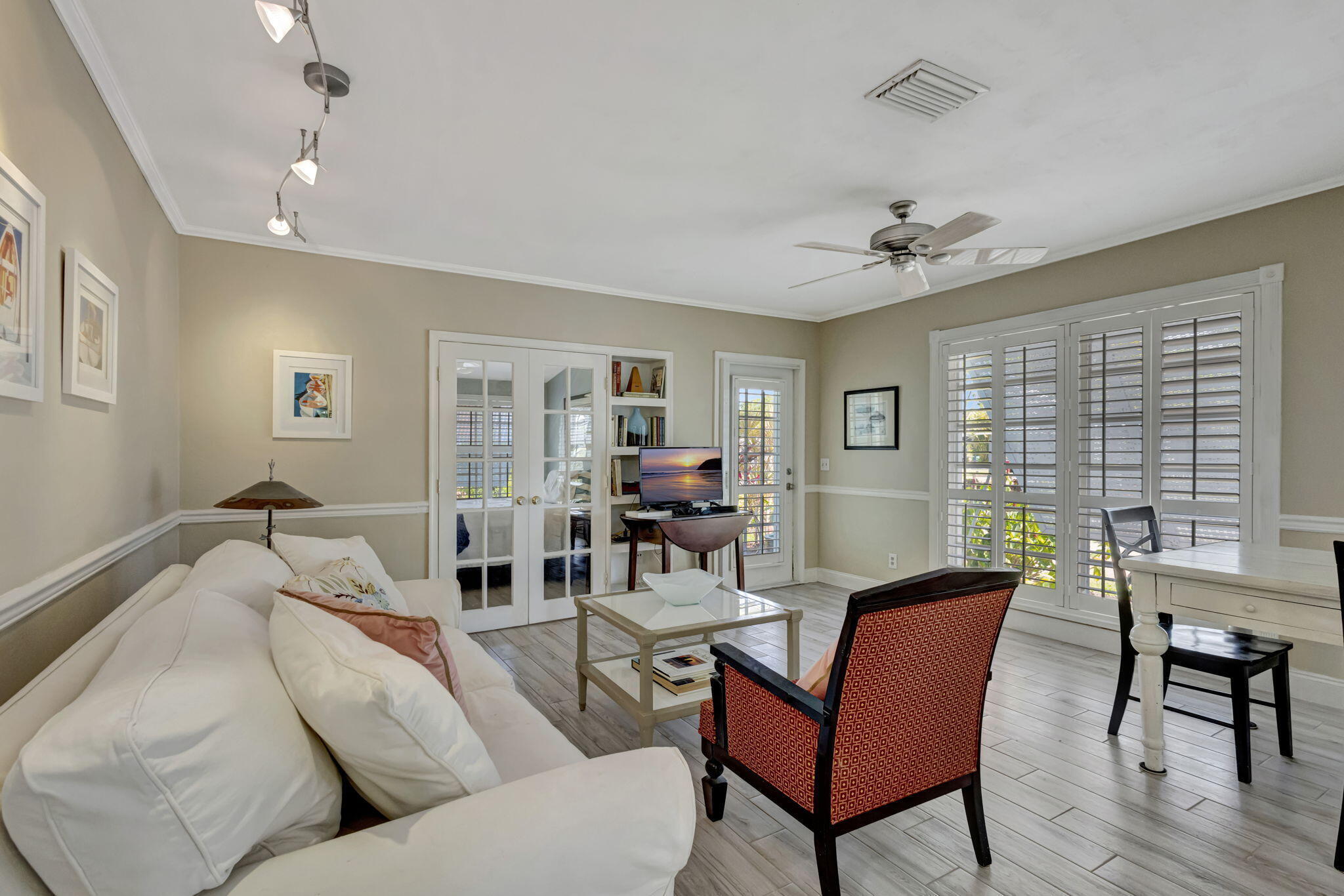 2940 Southeast Treasure Island Road Port St. Lucie, FL 34952 - Photo 10 of 61 a living room with furniture and wooden floor