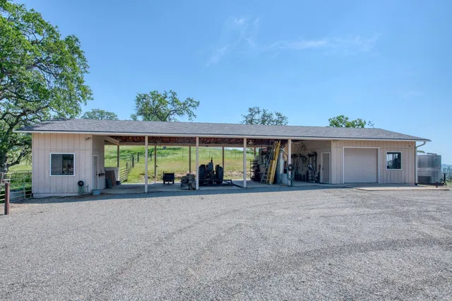 a view of a dining room with furniture wooden floor and chandelier