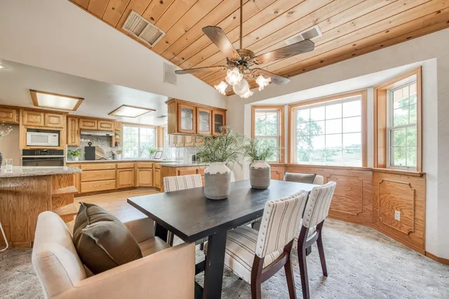 a living room with fireplace furniture and a fireplace