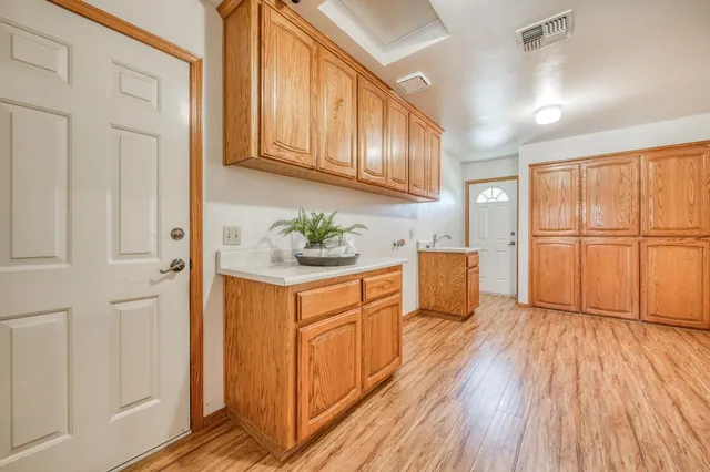 an aerial view of a houses with a yard