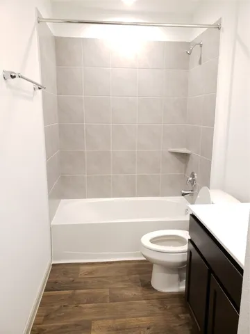 a bathroom with a sink a toilet and a bathtub
