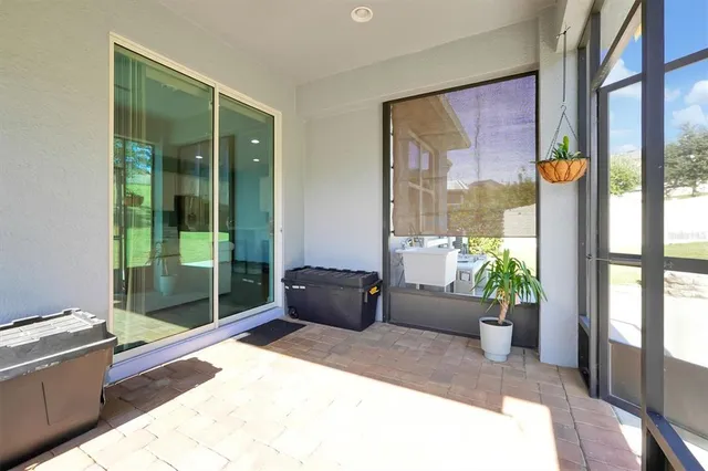 a view of a house with a backyard porch and sitting area