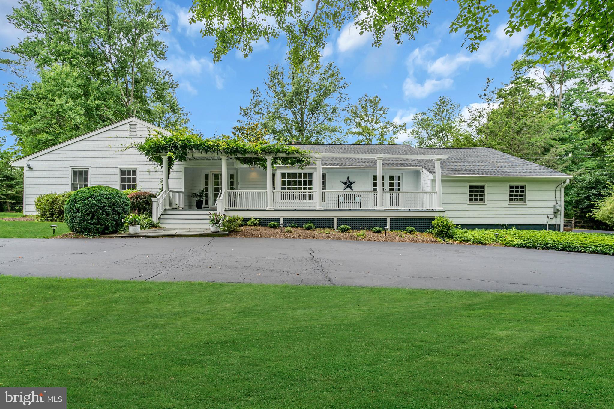 Spectacular pergola and wisteria covered porch