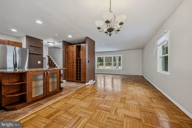 a view of a room with furniture and window