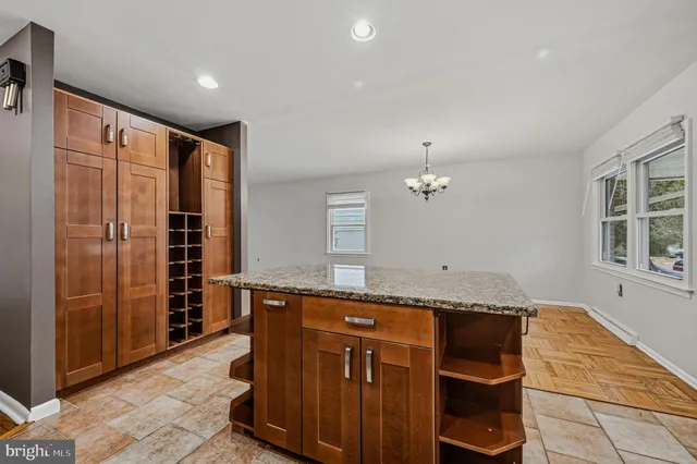 a kitchen with stainless steel appliances granite countertop a sink and a cabinets