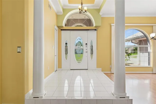 a view of a room with furniture and windows