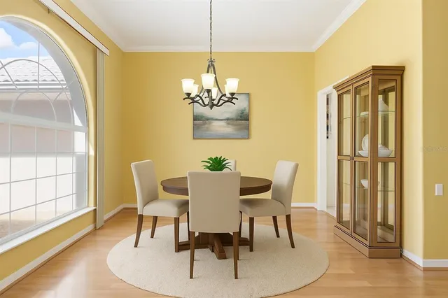 a view of a entryway with kitchen and windows