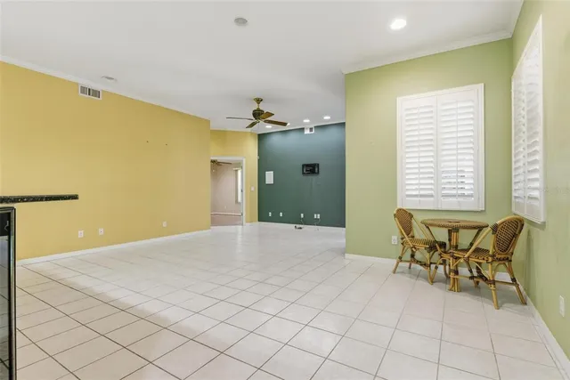 a view of a room with furniture and windows