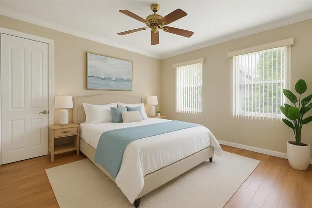 a large white kitchen with a sink and chandelier