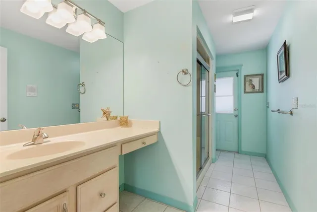 a view of a house with a backyard and a patio