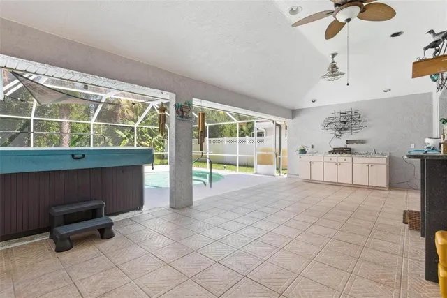 an aerial view of a house with a yard and potted plants
