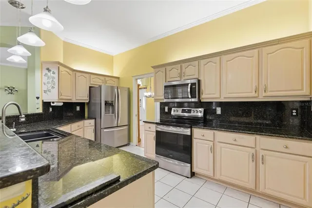 a kitchen with a sink and a stove
