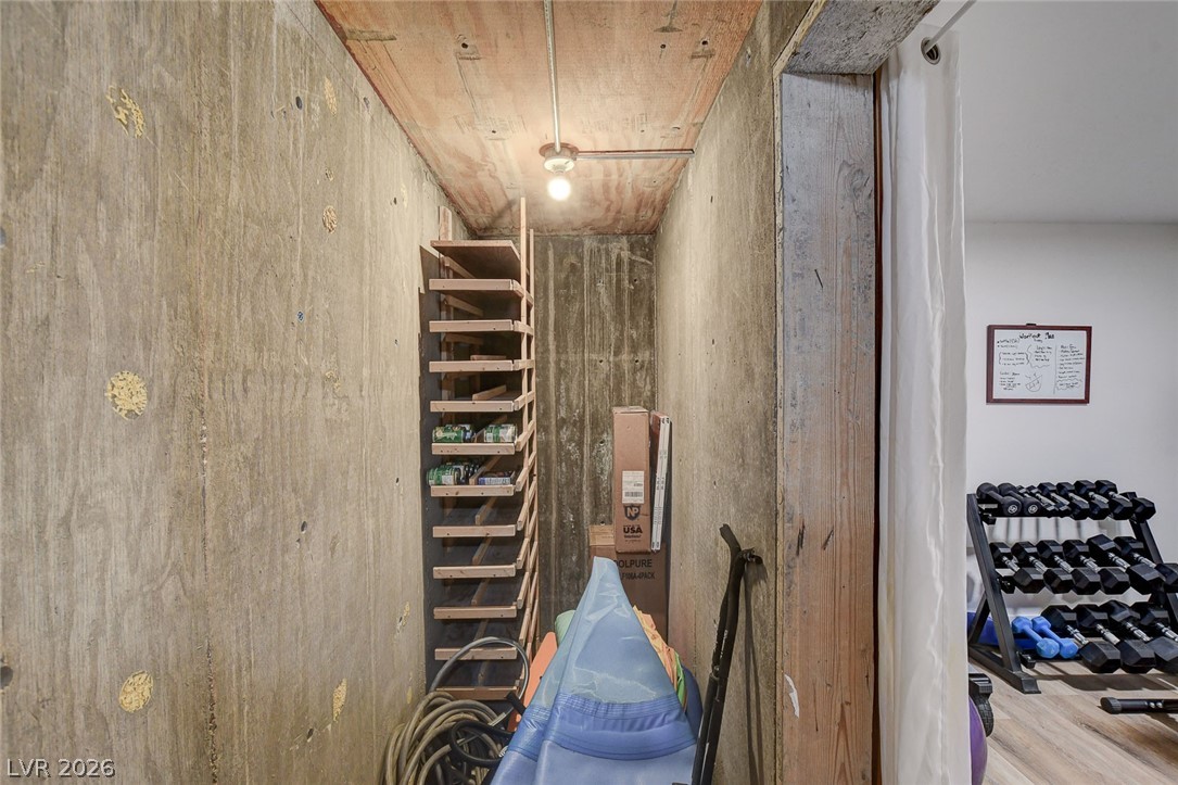 4362 Thistle Street Logandale, NV 89021 - Photo 67 of 99 An organized storage space features practical shelving and concrete walls, maximizing utility.