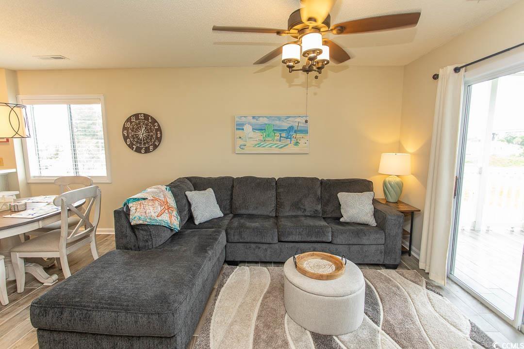 201 Landing Road, Unit D North Myrtle Beach, SC 29582 - Photo 11 of 40 Living room with ceiling fan, wood finished floors, and visible vents