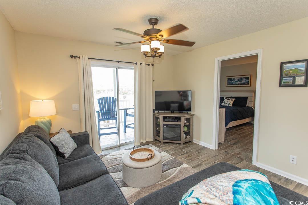 201 Landing Road, Unit D North Myrtle Beach, SC 29582 - Photo 12 of 40 Living room with baseboards, wood finish floors, and ceiling fan