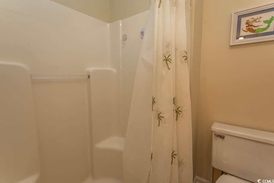 201 Landing Road, Unit D North Myrtle Beach, SC 29582 - Photo 22 of 40 Full bathroom featuring a shower with curtain and toilet