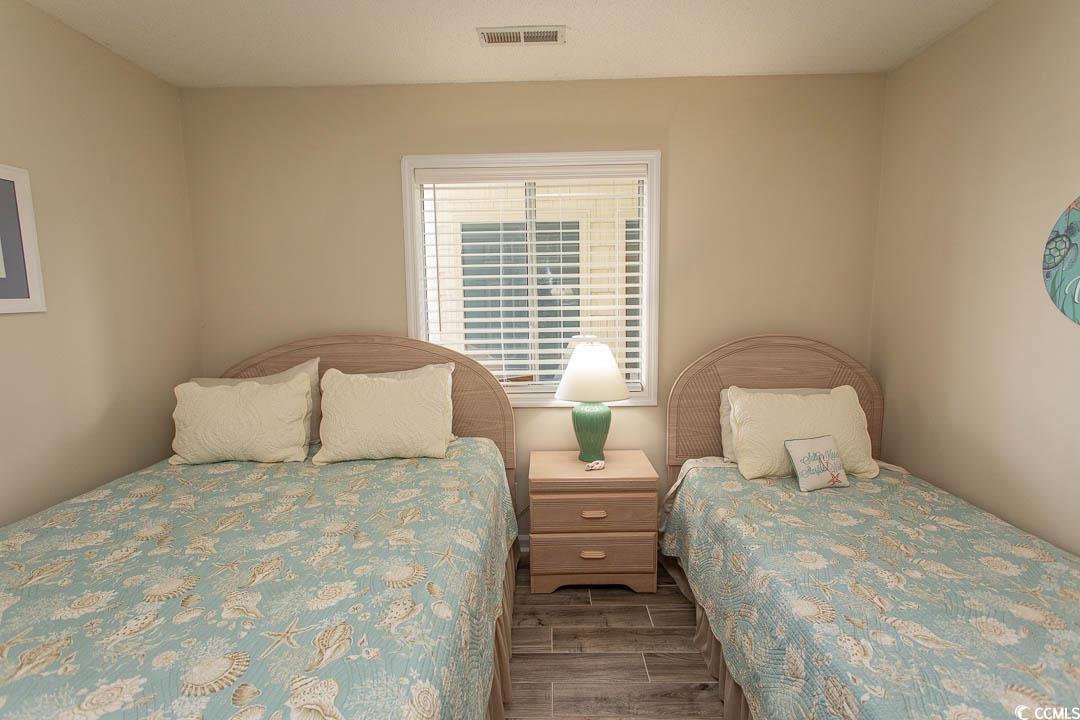 201 Landing Road, Unit D North Myrtle Beach, SC 29582 - Photo 24 of 40 Bedroom featuring wood finished floors and visible vents