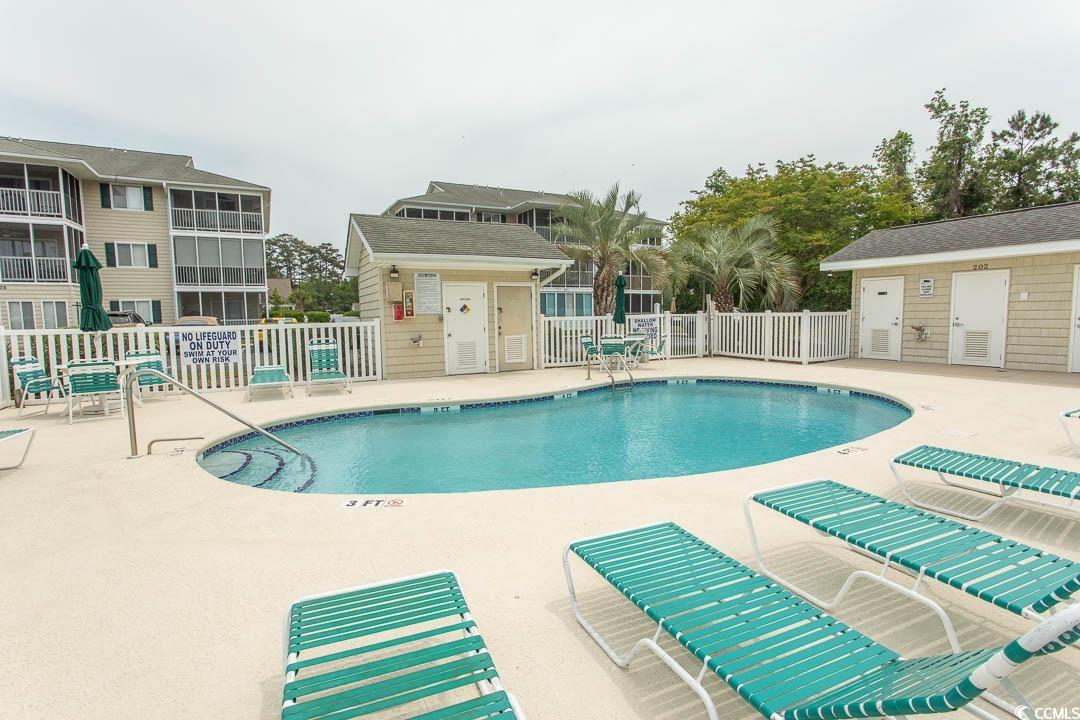 201 Landing Road, Unit D North Myrtle Beach, SC 29582 - Photo 35 of 40 Community pool featuring fence and a patio