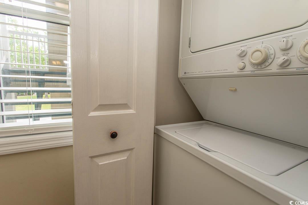 201 Landing Road, Unit D North Myrtle Beach, SC 29582 - Photo 7 of 40 Washroom with stacked washer and dryer and laundry area