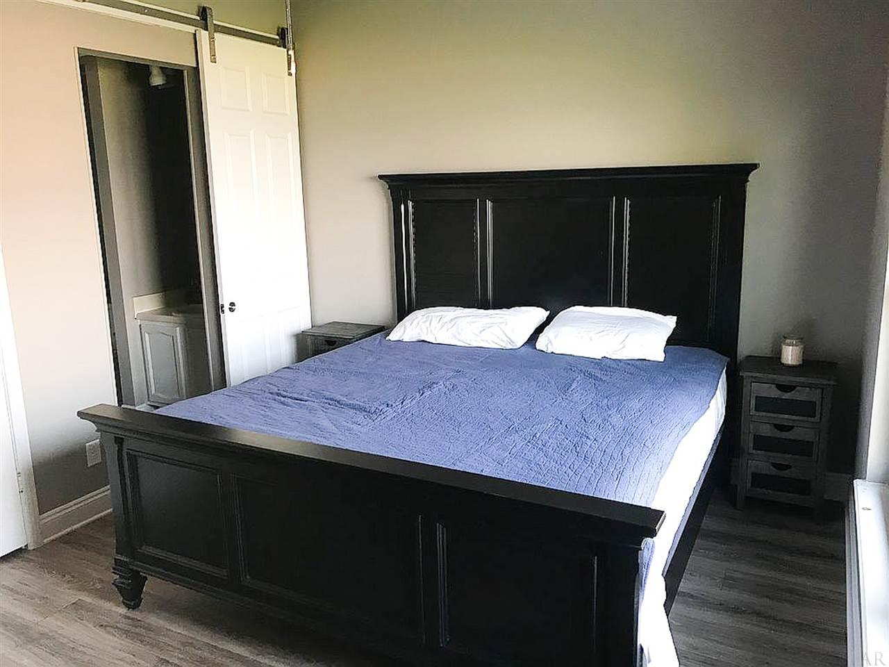 200 Pensacola Beach Road, Unit D6 Gulf Breeze, FL 32561 - Photo 10 of 25 Barn door into master bath