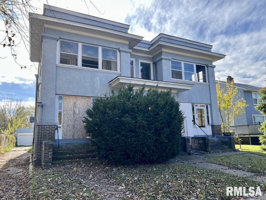513 6th Avenue South Clinton, IA 52732 - Photo 8 of 11 a view of a brick house with many windows