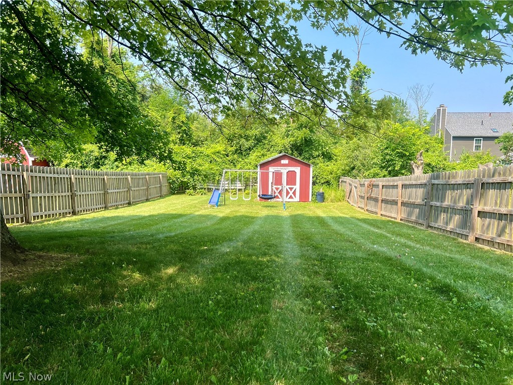 10071 Hazelton Road Streetsboro, OH 44241 - Photo 3 of 16 View of yard with a storage unit